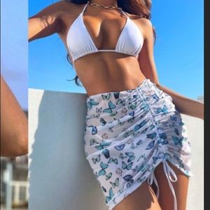 Beautiful white bikini with butterfly cover
